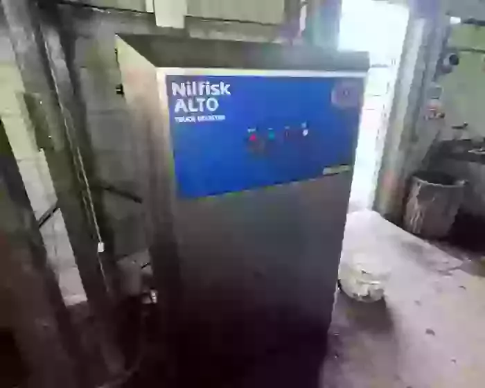 Nilfisk SH Truck Booster pressure washer after full service and internal pump overhaul, restored to smooth and reliable operation.